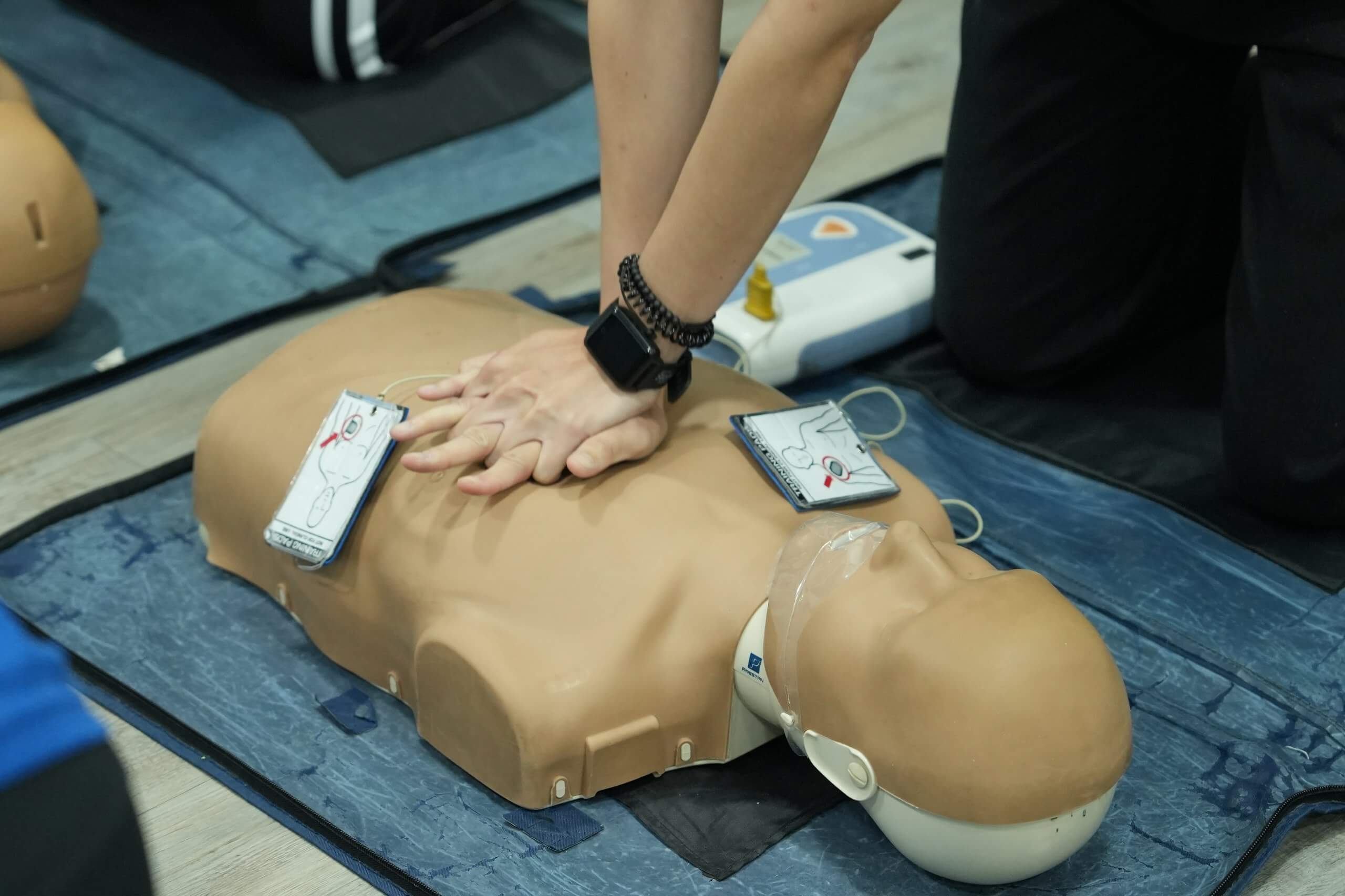 BCLS AED Aider practising CPR